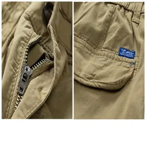 Close-up of metal zipper and pocket detail on khaki cotton cargo pants for men