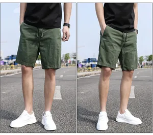 Casual men's olive green cargo shorts in a loose fit and five-point length design