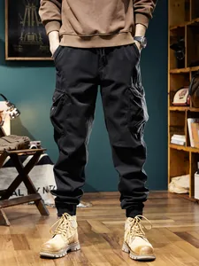 Stylish men's retro black fleece-lined cargo joggers with multiple pockets for winter wear