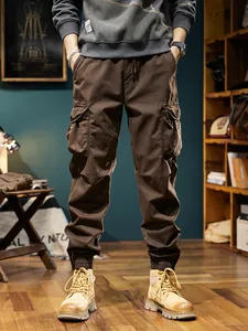 Men's vintage thermal cargo jogger pants in brown, featuring functional multi-pockets and drawstring