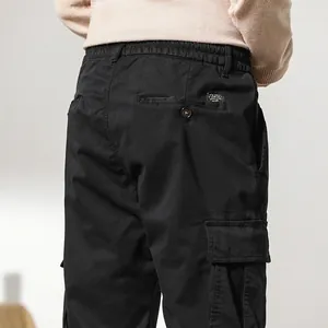 Men's winter loose cargo pants with thick fleece lining and multi-pocket design
