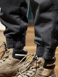 Men's winter fleece-lined cargo pants with elastic cuffs in a mountain vintage style