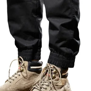 Men's thickened fleece jogger cargo pants in black with ribbed cuffs and work boots