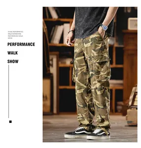 Model wearing vintage camouflage multi-pocket cargo pants in a library setting