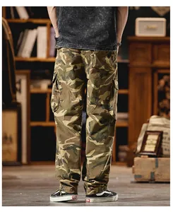 Detail view of men's vintage camouflage cargo pants with utility pockets and loose straight fit