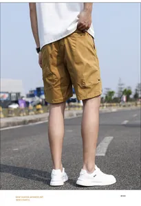 Back view of retro khaki men's cargo shorts in loose fit casual outdoor style
