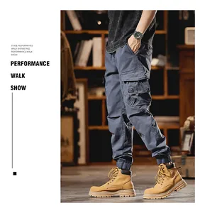 Detail view of blue multi-pocket cargo jogger pants for men with side pockets