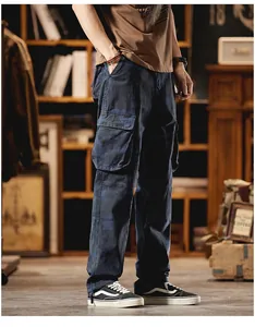 Detail view of vintage blue camouflage cargo pants with multi-pockets and loose fit.