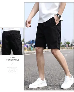 Detailed view of men's vintage black cargo shorts featuring a relaxed fit and pocket design