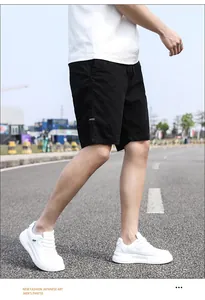 Detailed side view of men's casual black cargo shorts featuring a comfortable loose fit style