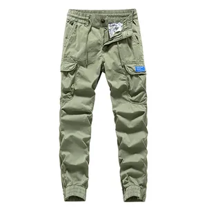 Men's olive green cargo jogger pants with multiple pockets and ankle zippers.