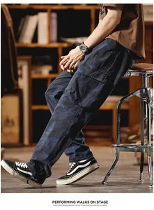 Side detail view of blue camouflage cargo pants featuring several utility pockets