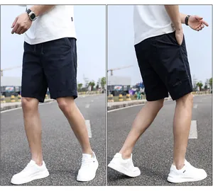 Side and front views of navy blue men's casual cargo shorts for summer outdoor activities.