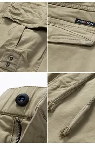 Détails macro d'un pantalon cargo kaki montrant poches multiples, fermeture et cordons.