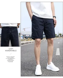 Detail of men's navy blue casual cargo shorts with drawstring waist and side zipper