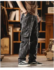 Side view of vintage camouflage cargo pants with multiple pockets and loose straight fit