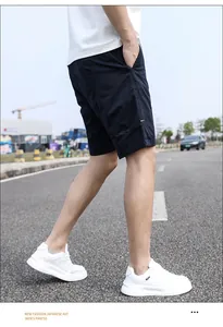 Side view of navy blue vintage cargo shorts for men, loose fit for summer outdoor wear