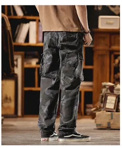 Close-up detail of vintage camouflage cargo pants featuring multi-pockets and loose fit.