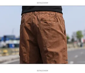Back detail view of brown vintage men's cargo shorts featuring an elastic waist and pockets