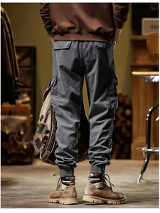 Back view of men's retro grey cargo pants with elastic cuffs and multiple pockets