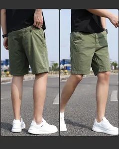 Detailed outdoor view of army green Japanese style vintage cargo shorts for men