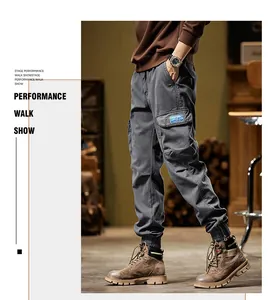 Full-body shot of men's grey vintage cargo pants with relaxed fit for winter wear