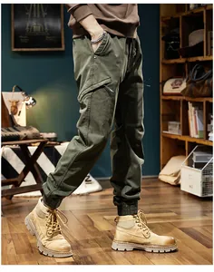Detail view of men's olive green outdoor cargo joggers with ribbed cuffs