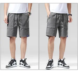 Detailed front view of men's grey relaxed fit cargo shorts with drawstring waist.