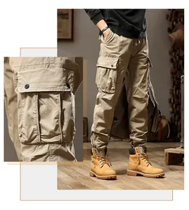 Detailed macro view of pocket design on khaki mens cargo pants for outdoor streetwear style