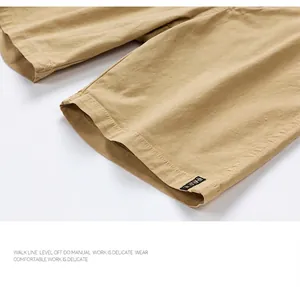 Close-up of khaki cargo shorts leg opening highlighting the precise stitching and cotton texture