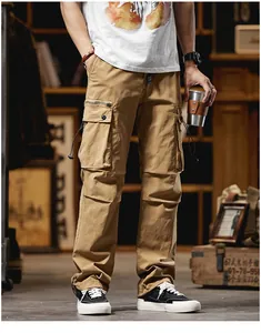 Close-up view of men's khaki straight leg cargo pants with side pockets in vintage style.