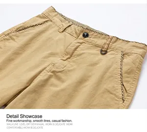 Detail shot of men's khaki shorts waist showing fine stitching and inner checkered trim.