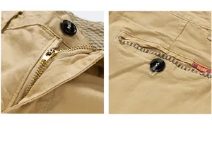 Close-up of metal zipper and back pocket detail on khaki vintage men's cargo shorts