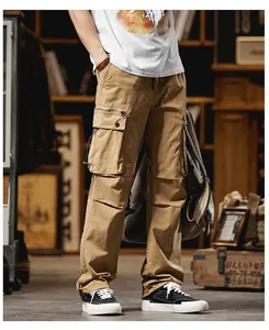 Detail view of men's khaki cargo pants with functional side pockets and a relaxed straight fit