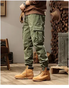 Side view of olive green men's multi-pocket cargo jogger pants with elastic cuffs