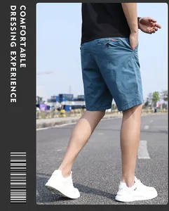 Back view of men's blue retro casual shorts in an outdoor lifestyle setting