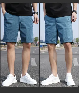 Detail of men's vintage blue cargo shorts on model for casual styling