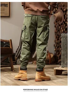 Rear view detail of olive green multi-pocket cargo pants with elastic cuffs for men