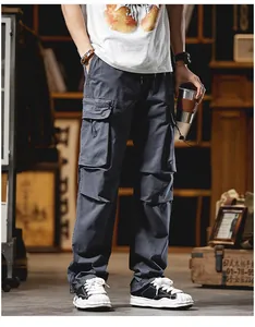 Detailed view of men's high street cargo pants with multiple pockets and straight leg fit.