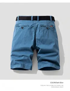 Back view of men's vintage blue cargo shorts with belt and button pockets
