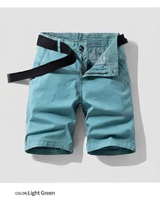 Close-up detail showing men's retro light green cargo shorts featuring a black belt.