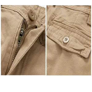 Close-up of khaki cotton cargo shorts featuring a metal zipper and button-flap pocket.