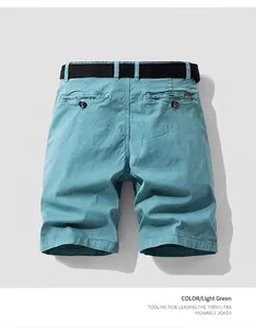 Detailed back view of vintage light green men's cargo shorts with included black belt