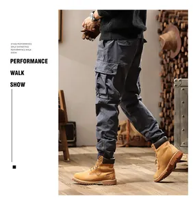 Detail view of men's vintage grey multi-pocket cargo pants featuring elastic cuffs