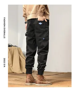 Close-up back view of men's black casual cargo jogger pants featuring side pockets