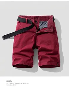 Close-up of wine red men's cargo shorts with black belt showing waist detail