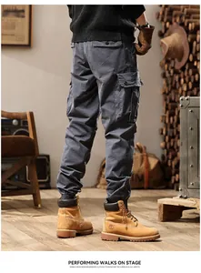 Detailed back view of men's grey multi-pocket retro cargo pants with jogger cuffs