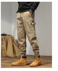Side detail of men's khaki Japanese style cargo joggers with tapered ribbed cuffs