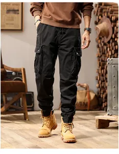 Detailed close-up view of men's multi-pocket black cargo pants in vintage street style