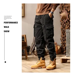 Detailed view of men's black street-style cargo joggers with multi-pocket design